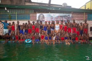 A group photo of swimmers, coaches, and volunteers that participated in No Limit International's swimming camp in July 2022.